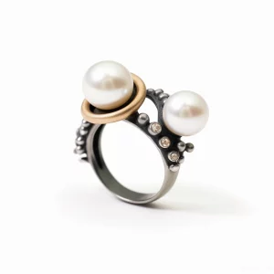 blackened silver ring with two pearls and zircon accents