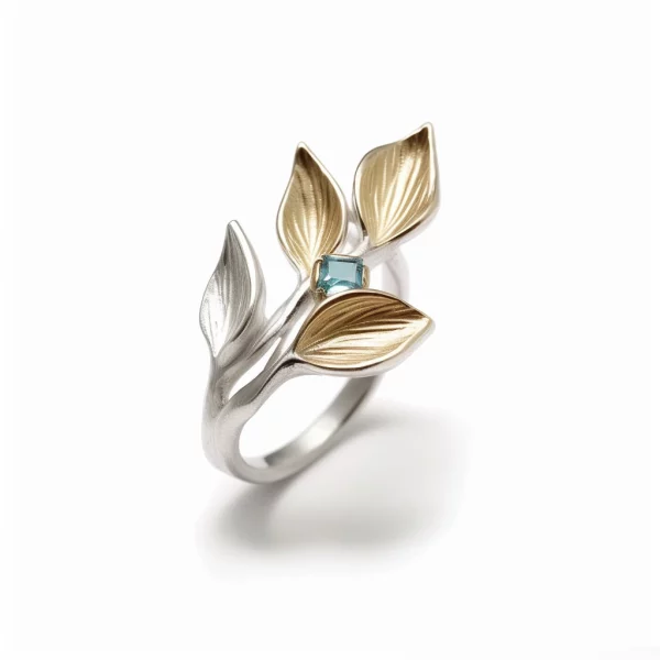 silver ring with gold-plated leaves and topaz gemstone