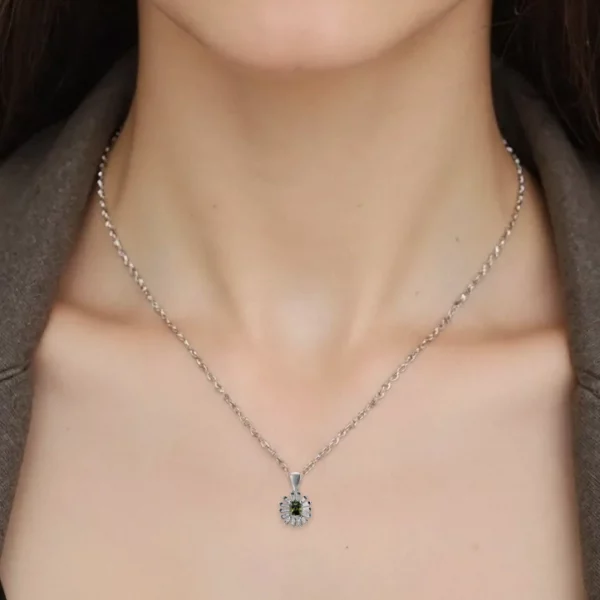 zultanite and zircon silver pendant, on model