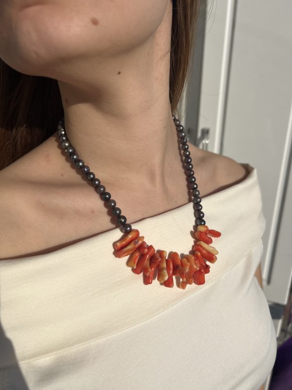 coral and pearl necklace on model